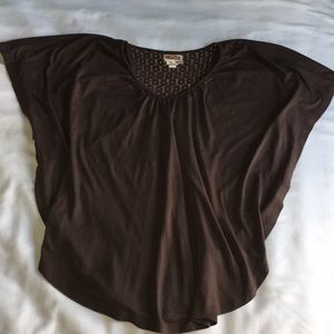 Brown, flowy shirt.